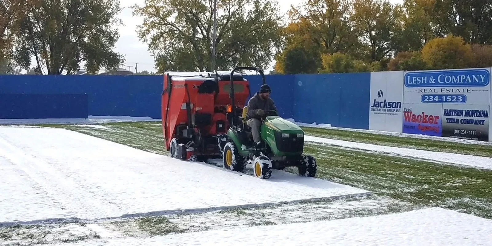 Snow plowing on field