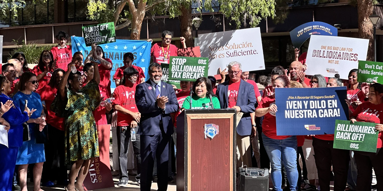 Member speaks at rally