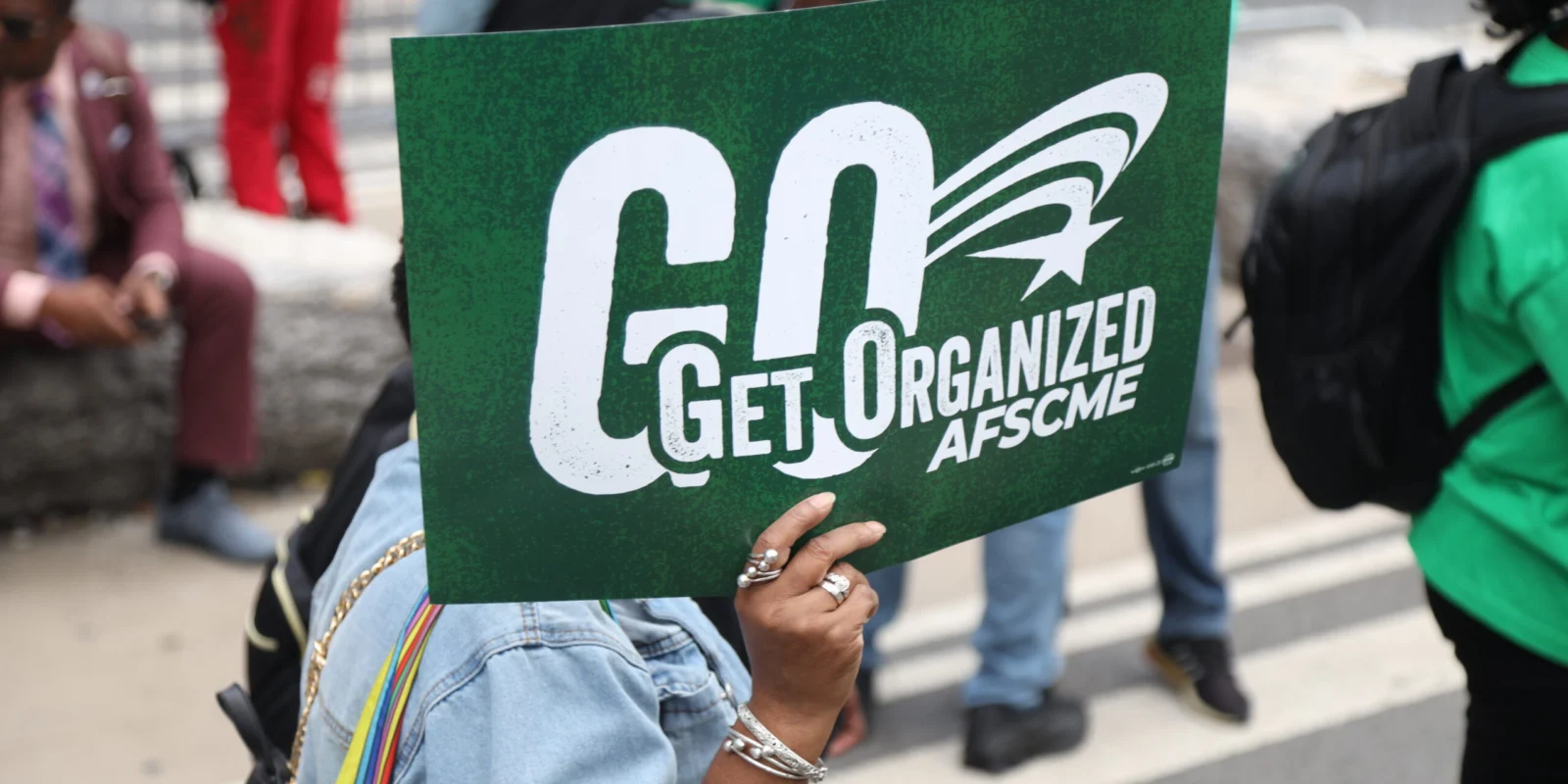 Woman hold Get Organized sign