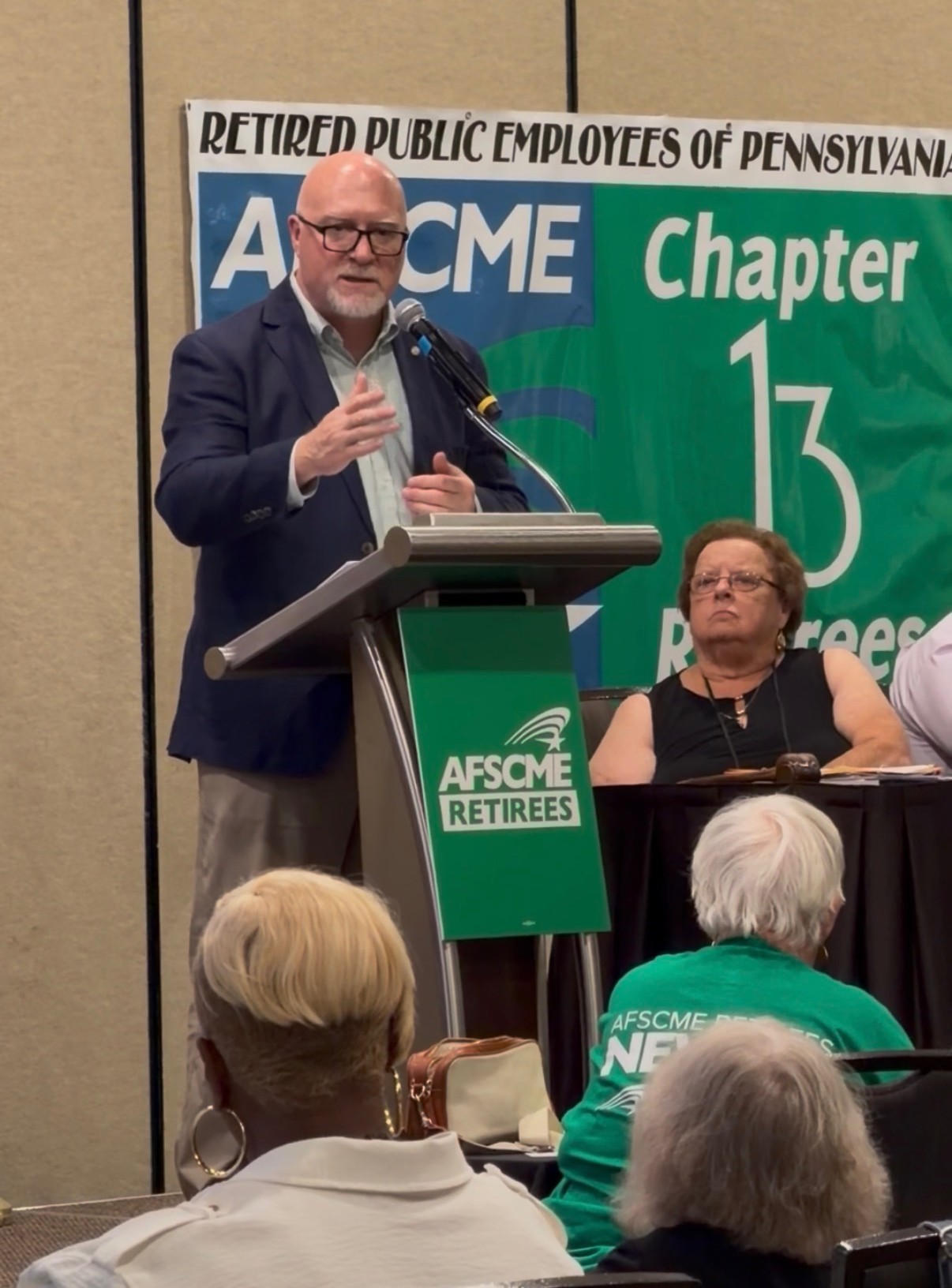 AFSCME President Patrick Moran speaks to retirees as International Executive Board Retiree Representative Jeanne Weaver looks on. Photo: AFSCME Retirees.